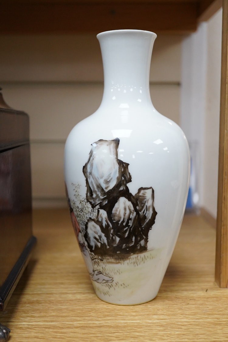 A Chinese famille rose vase, decorated with Shou Lao and script, 23cm